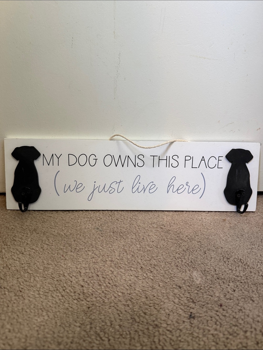 My Dog Owns This Place Wooden Wall Sign - White with Black Dog Hooks